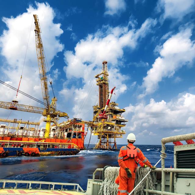Technician or worker on the crew boat during transfer to platform or drilling rig in process oil and gas platform offshore,technician